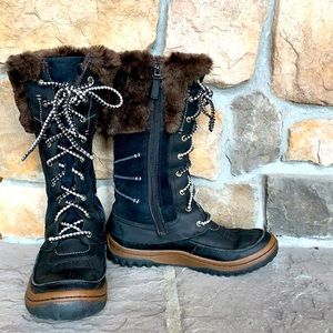 Women’s black Merrell boot.